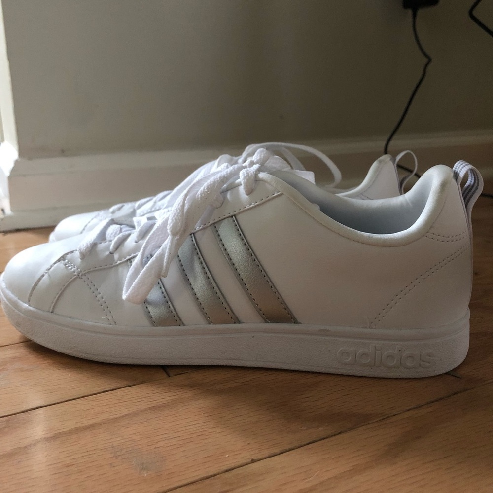 Silver and white adidas advantage strips sneaker